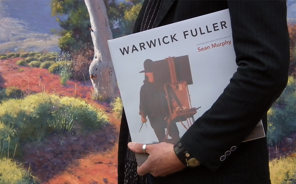Image of man holding Warwick Fuller's book
